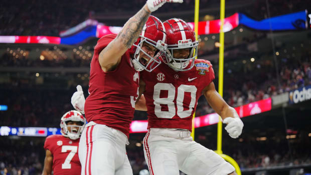 Alabama Crimson Tide wide receiver Kobe Prentice (80) celebrates his touchdown scored against the Kansas State Wildcats with wide receiver Jermaine Burton (3) during the second half in the 2022 Sugar Bowl at Caesars Superdome.